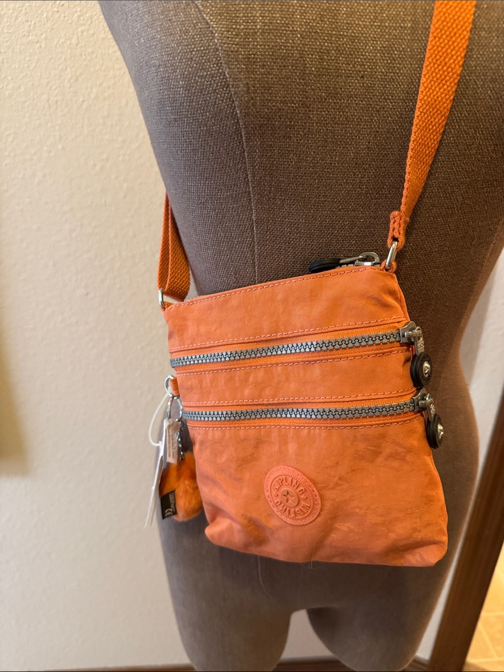 Kipling Orange Compact Crossbody with Dual Zip Pockets